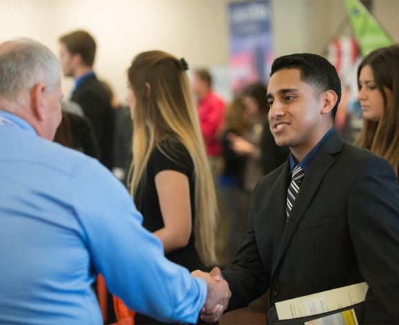 University of the Pacific graduate students network with potential employers on the Stockton campus.